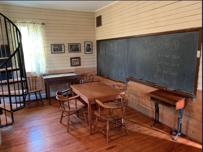 The old blackboard and school desk are perfect for this old schoolhouse. 